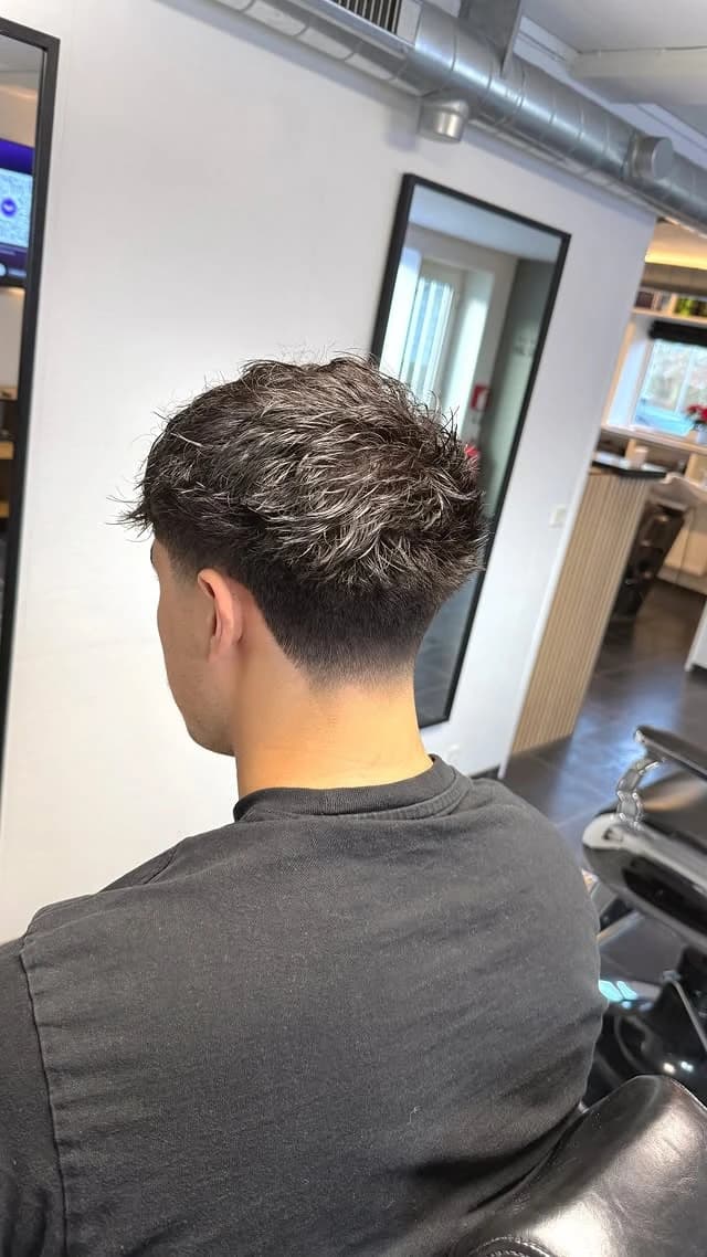 Wavy textured cut with a taper, back view